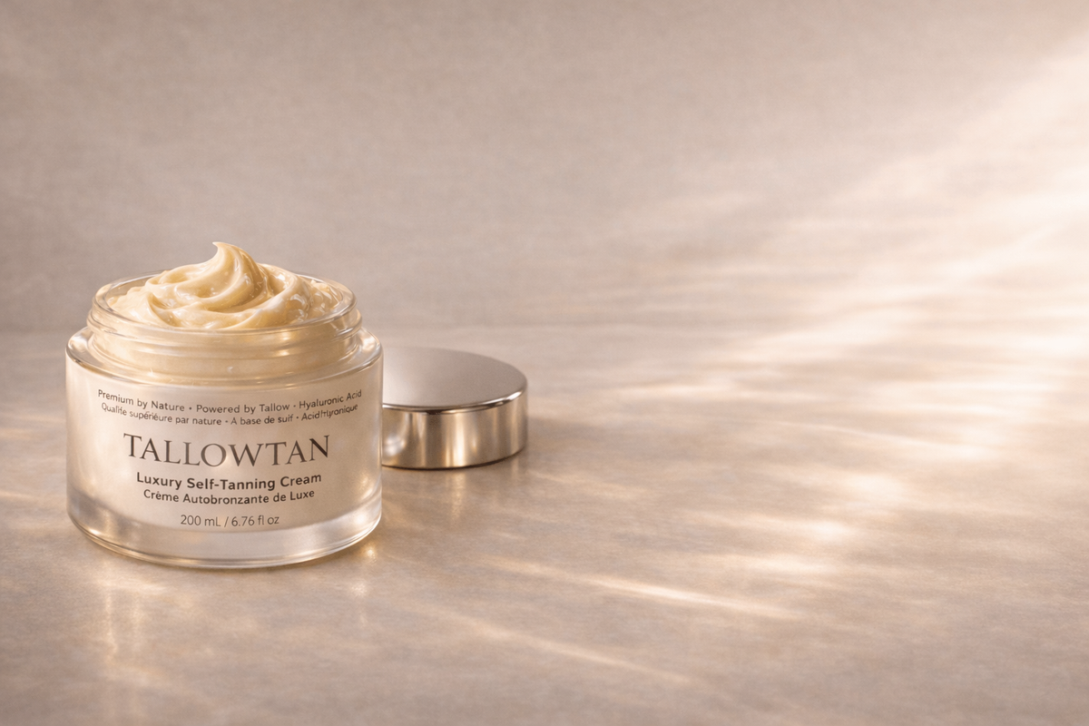 Open jar of Tallowtan tallow self tanning cream with the lid beside it, showing the whipped texture
